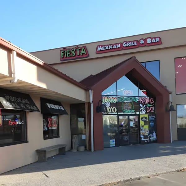 Exterior of Fiesta Mexican Grill & Bar, a restaurant with a prominent sign and large windows.